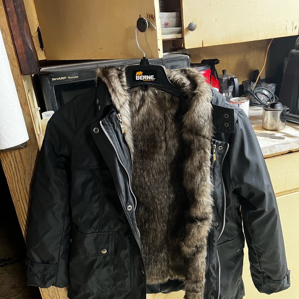 Nice and cozy parka jacket never worn or used. Just bought too small.